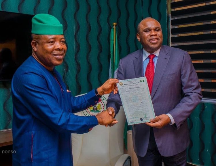 Rt. Hon Emeka Ihedioha(Left) presenting Certificate of Occupancy for the site of African Quality Assurance Centre (AQAC) in Ngor Okpala to the President of Afrexim Bank, Prof. Benedict Oramah, January 6, 2020