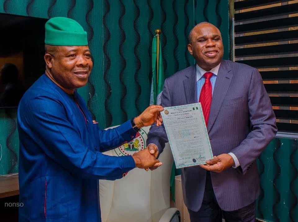 Rt. Hon Emeka Ihedioha(Left) presenting Certificate of Occupancy for the site of African Quality Assurance Centre (AQAC) in Ngor Okpala to the President of Afrexim Bank, Prof. Benedict Oramah, January 6, 2020