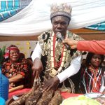 Eze Okeke cutting the yam for his people of Ihioma,during festival,held,recently.