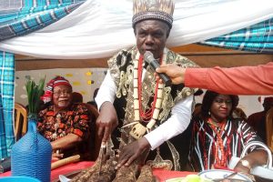 Eze Okeke cutting the yam for his people of Ihioma,during festival,held,recently.